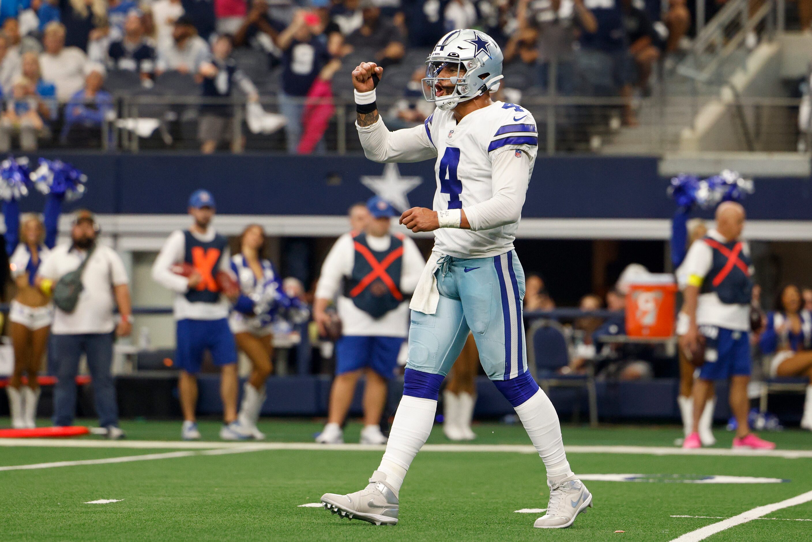 Dallas Cowboys quarterback Dak Prescott (4) celebrates a touchdown by running back Ezekiel...