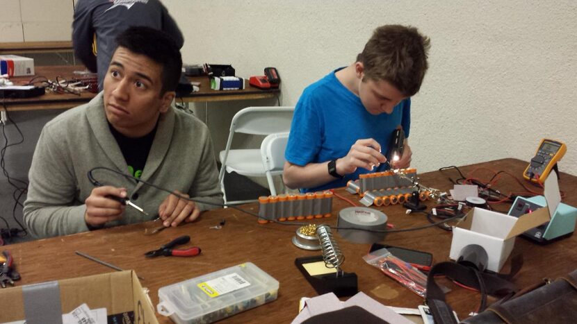 
Alejandro Hernandez (left) and Jack Doan work on electrical components of the Blender at...