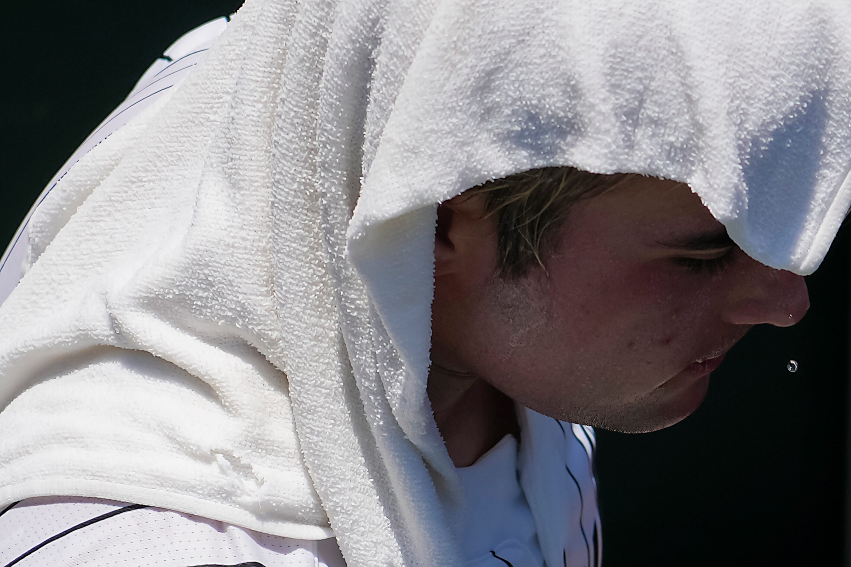 Argyle catcher Hunter Sandifer cools off between innings of a UIL 4A baseball state...