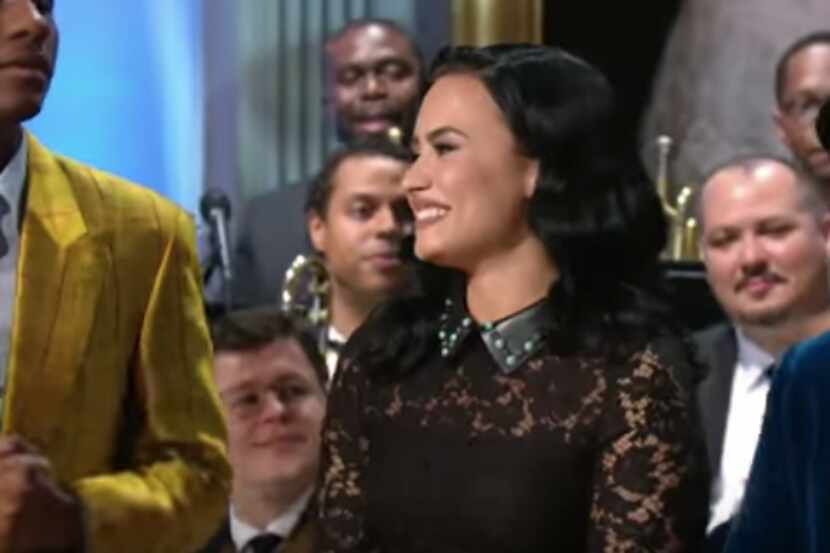 Demi Lovato at the finale of last night's White House concert. That's Leon Bridges to the...