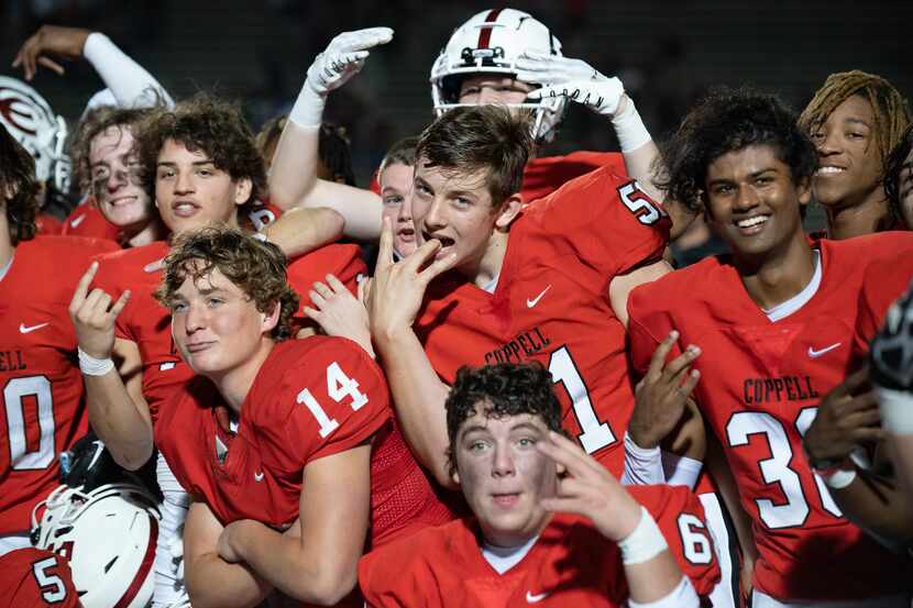 Coppell Cowboys celebrate after defeating Plano Wildcats 34 to 7 at including Buddy Echols...