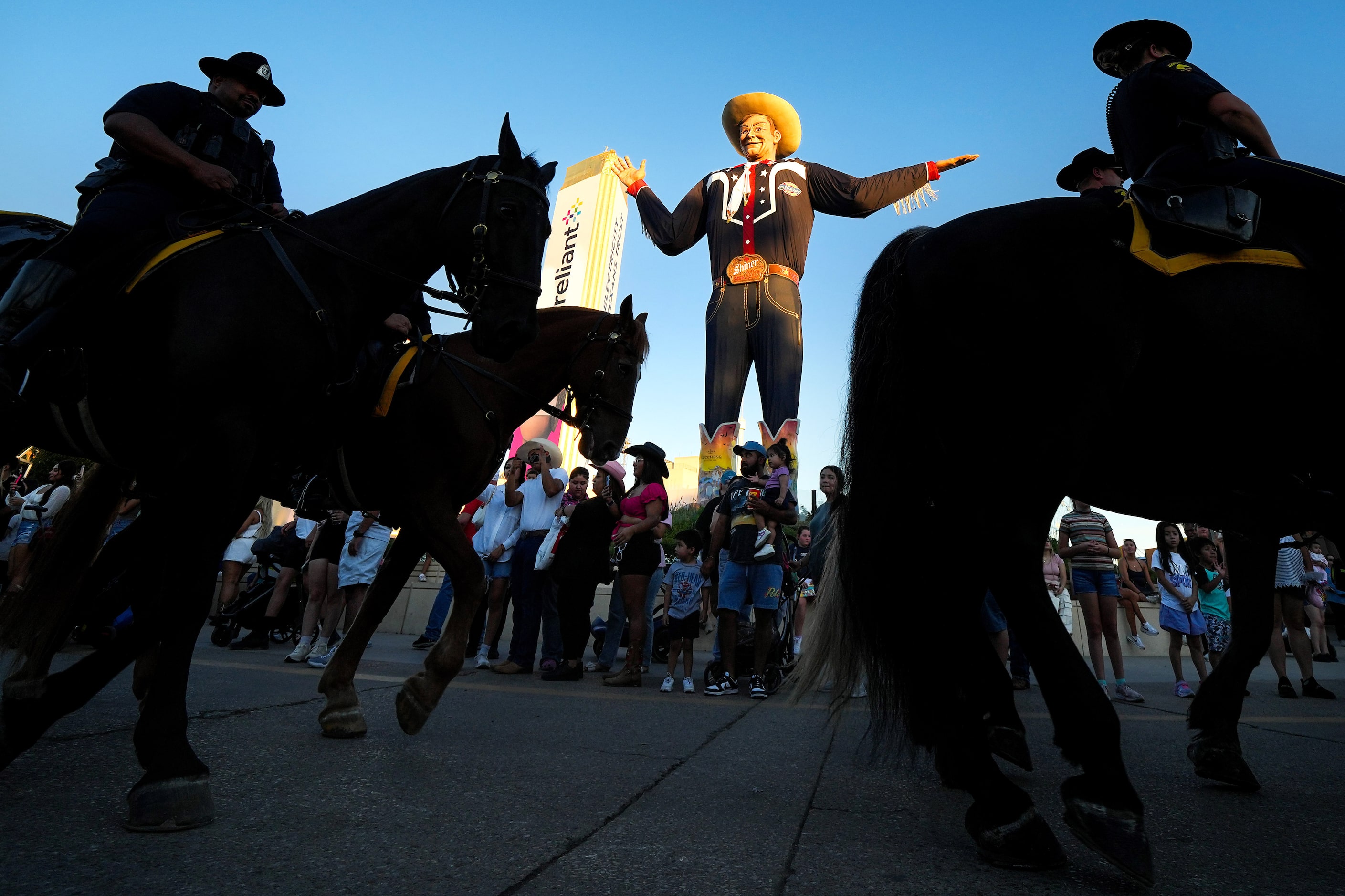 The Dallas Police Department Mounted Unit rides though Big Tex Circle at the State Fair of...