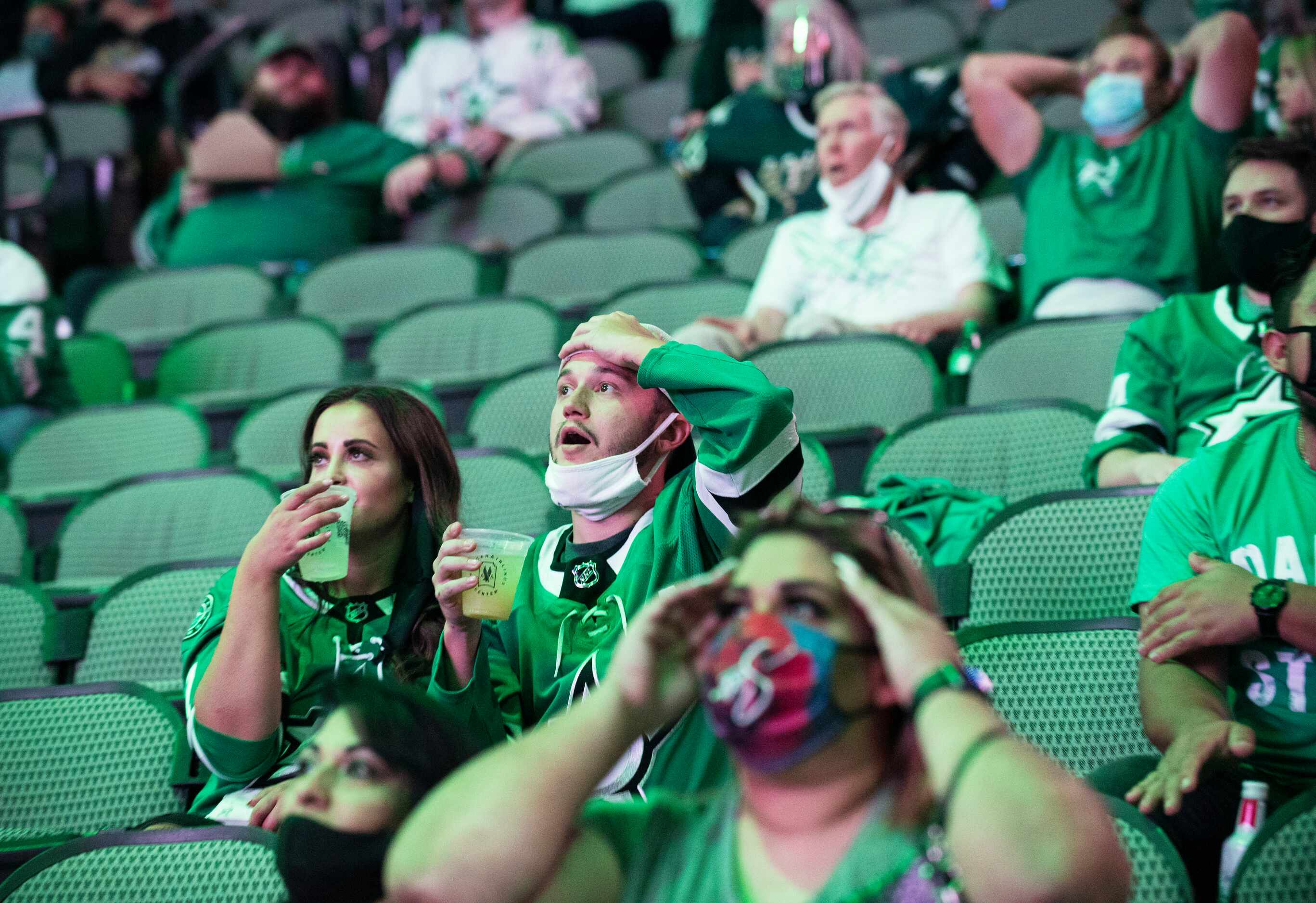 Fans react with disbelief while watching the Tampa Bay Lightning versus the Dallas Stars...