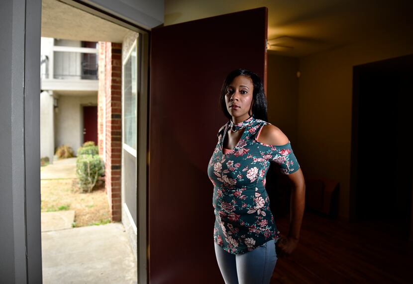 Shakena Walston, 29, originally from Tulsa, Okla., stands at the doorway of her apartment in...