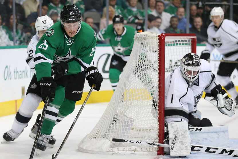 Dallas Stars right wing Brett Ritchie (25) attempts to move the puck near the net while...
