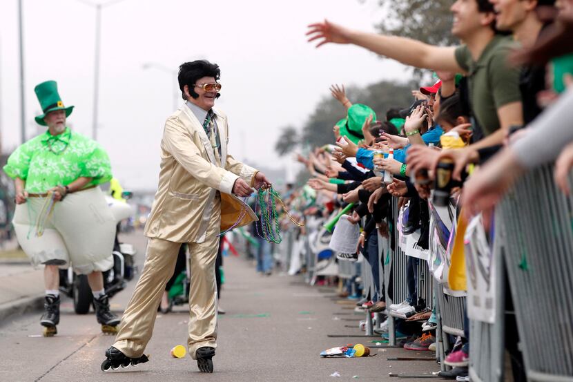 An Elvis impersonator handed out beads  during the Dallas St. Patrick's Parade & Festival.