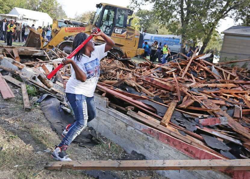 In October 2017, Cynthia King, great-aunt of Shavon Randle, takes a sledge hammer to put the...