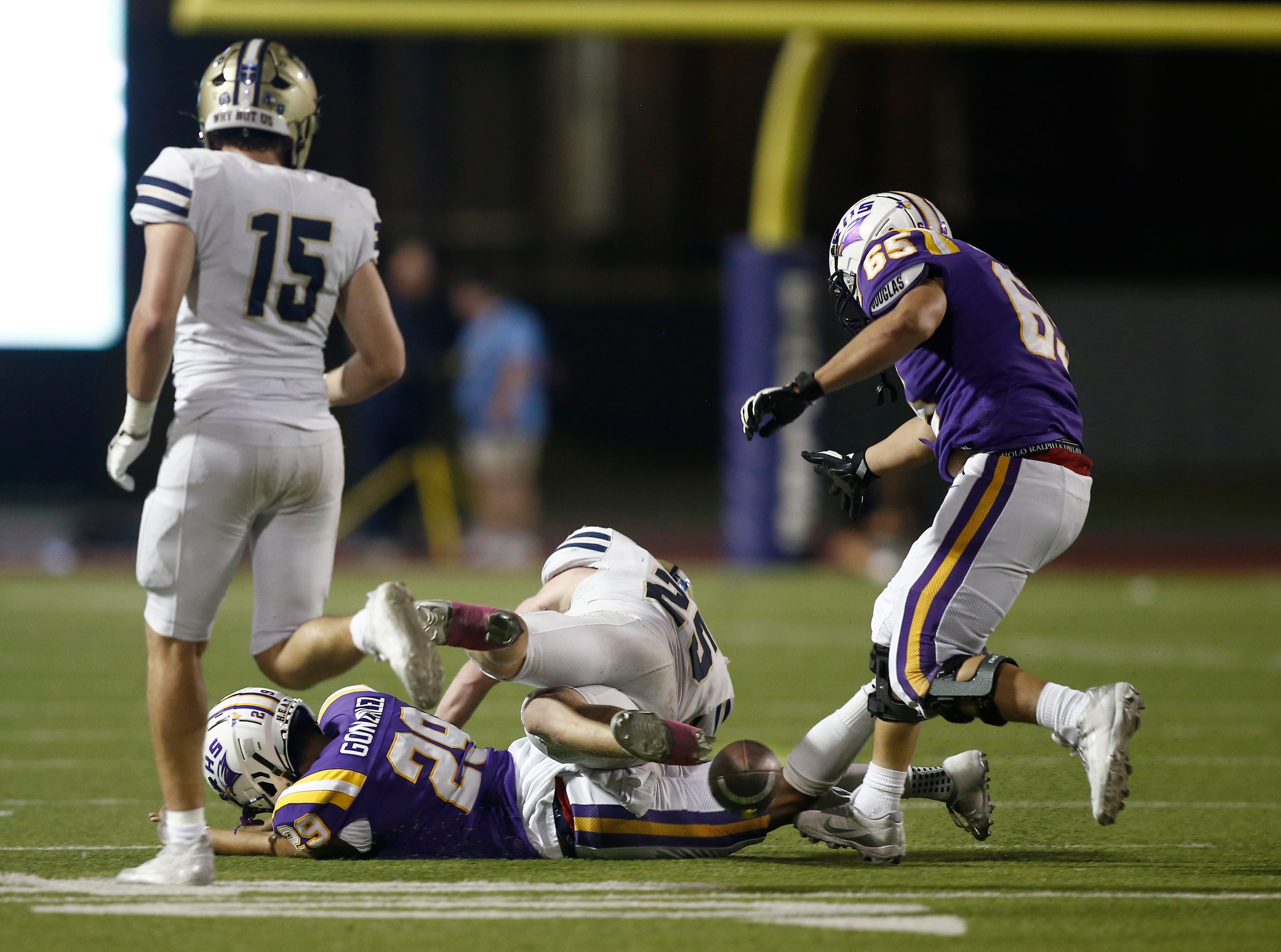 Jesuit defensive back Robert Prager (15), linebacker Julien Bird (25), Richardson kicker...