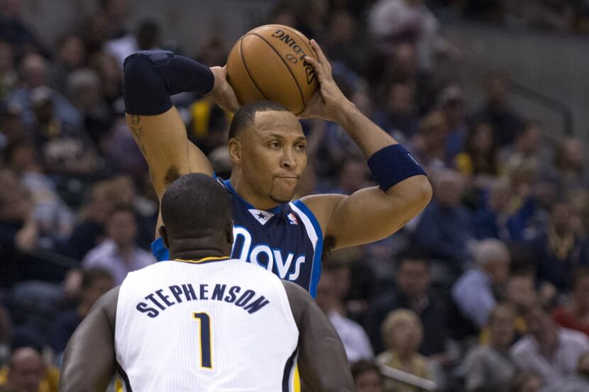 Dallas Mavericks' Shawn Marion, top, looks for help as Indiana Pacers' Lance Stephenson...