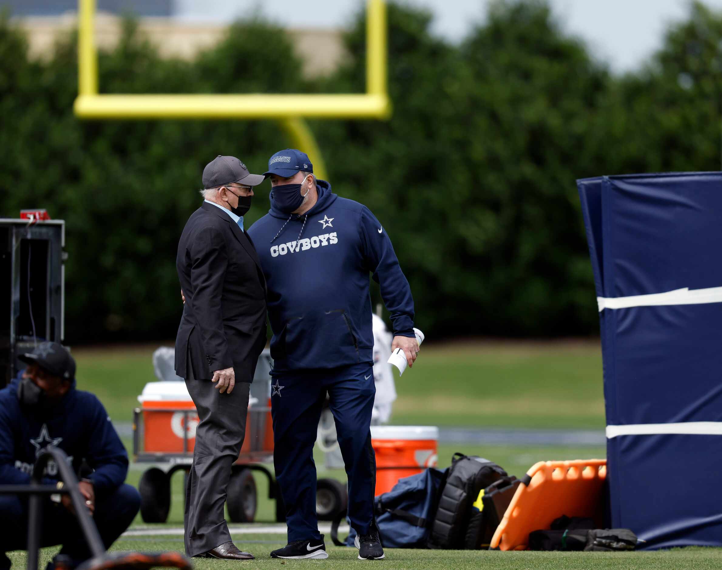 Dallas Cowboys owner Jerry Jones (left) and head coach Mike McCarthy visit on the sideline...