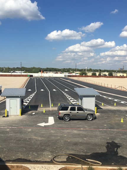 Six lanes of traffic extend for 500 feet from the main road, ensuring more efficient traffic...