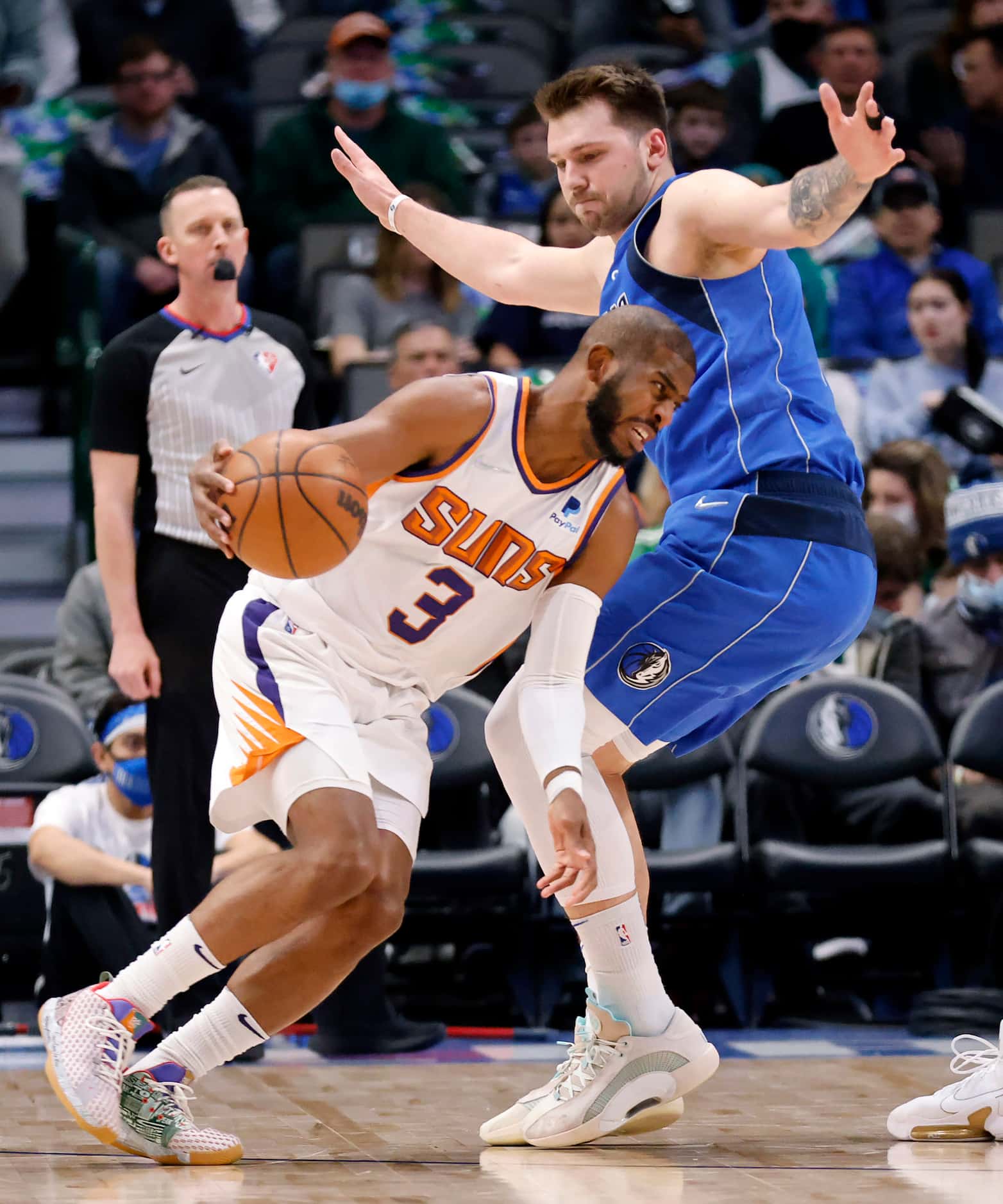 Phoenix Suns guard Chris Paul (3) tries to get around Dallas Mavericks guard Luka Doncic...