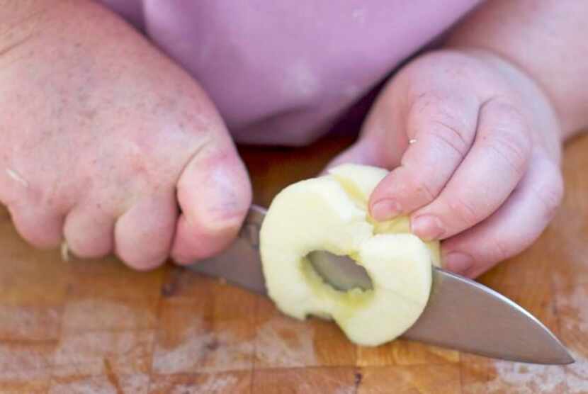 
When slicing the apple stop each slice when you're still about 1/4 inch from the surface of...