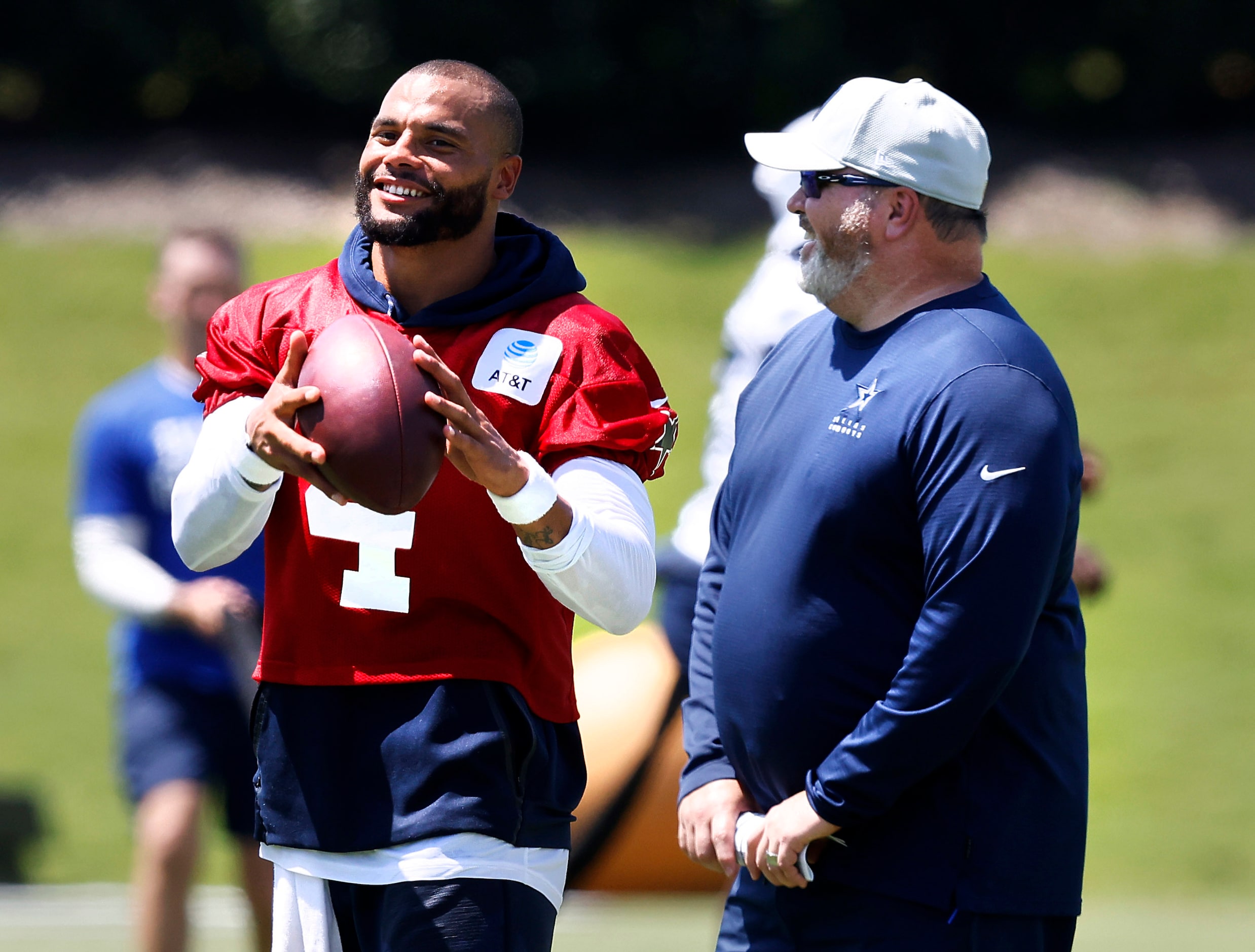 Dallas Cowboys head coach Mike McCarthy and  quarterback Dak Prescott (4) laugh following...