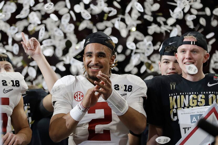 Alabama's Jalen Hurts celebrates after overtime of the NCAA college football playoff...