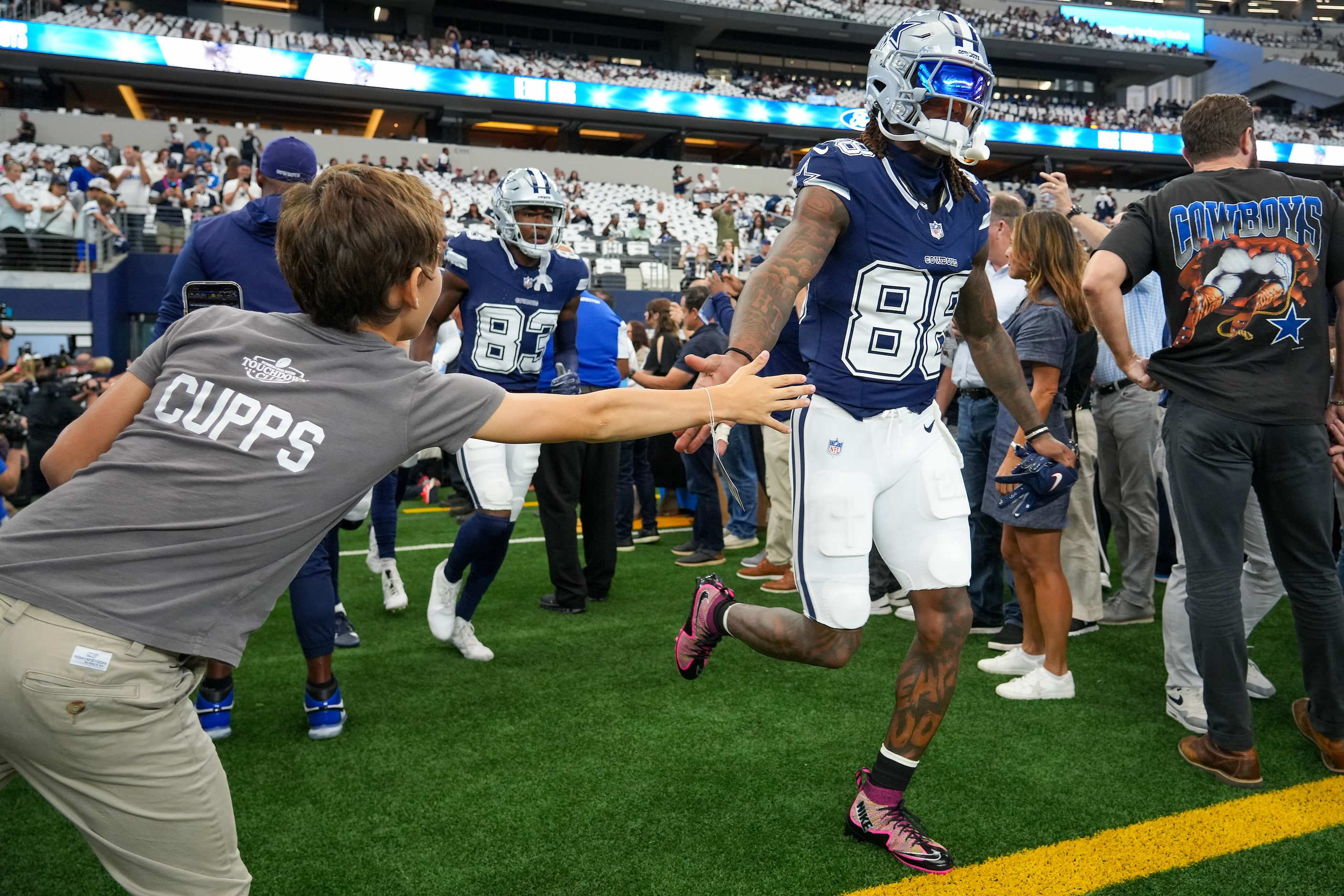 Dallas Cowboys wide receiver CeeDee Lamb (88) takes the field for team warm ups before an...