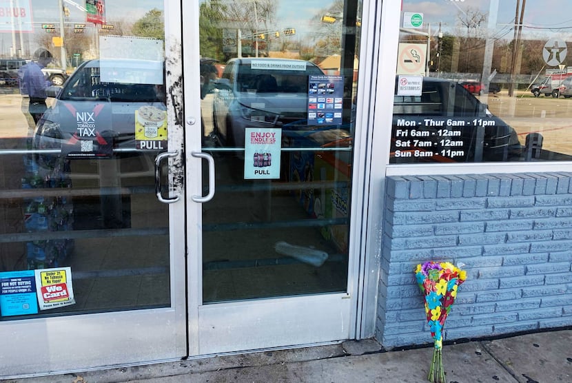 Flowers were placed outside the Texaco station where three teenagers were fatally shot in...