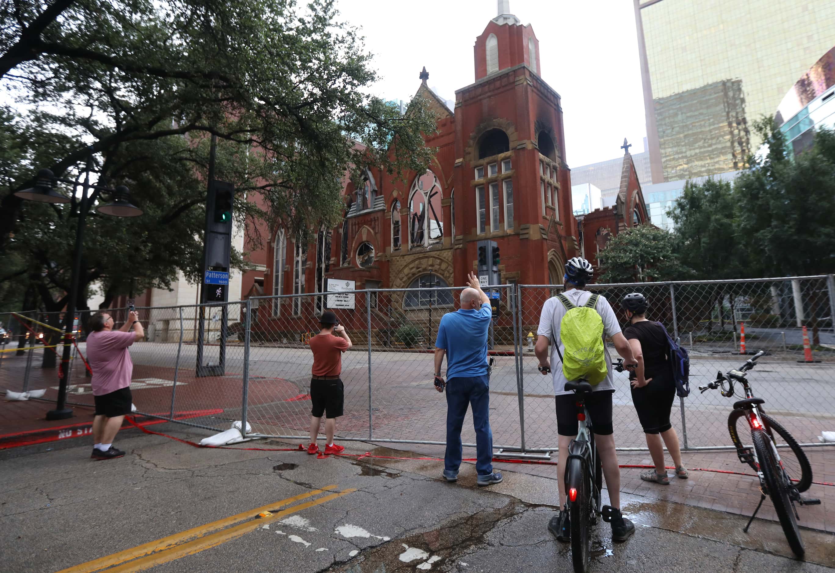 People gather at the site of a fire at First Baptist Dallas church, Sunday, July 21, 2024,...