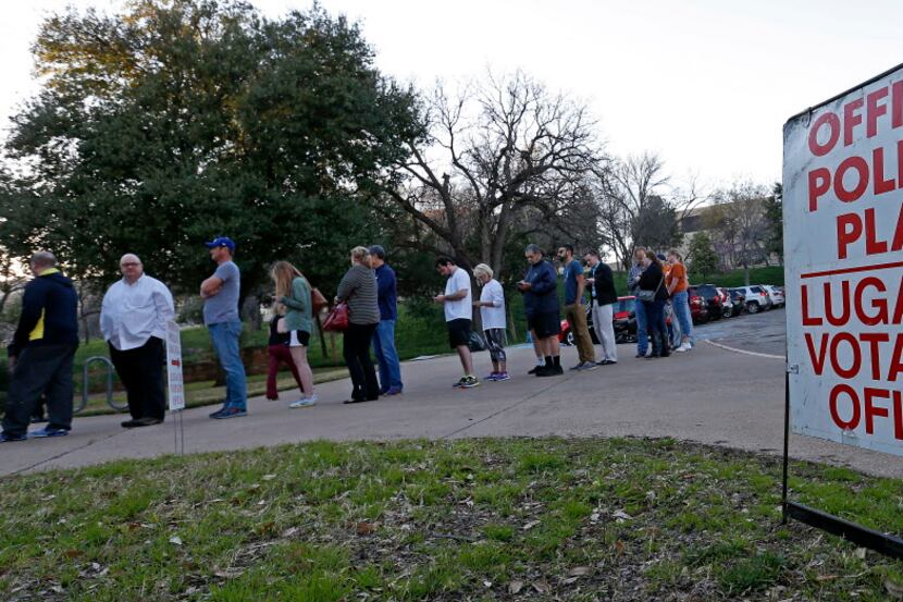 Voters for the Republican primary waited outside Reverchon Park Recreation Center in Dallas,...