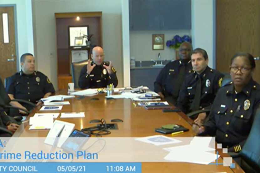 A screengrab of Dallas Police Chief Eddie Garcia, center, as he talks during a virtual...