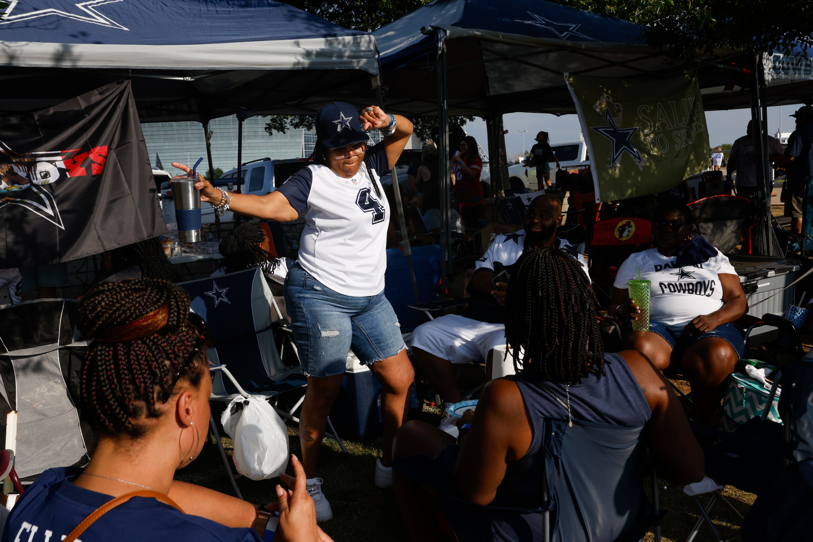 Roshunda Wade of Fort Worth dances during a tailgate before the start of the Cowboys game...