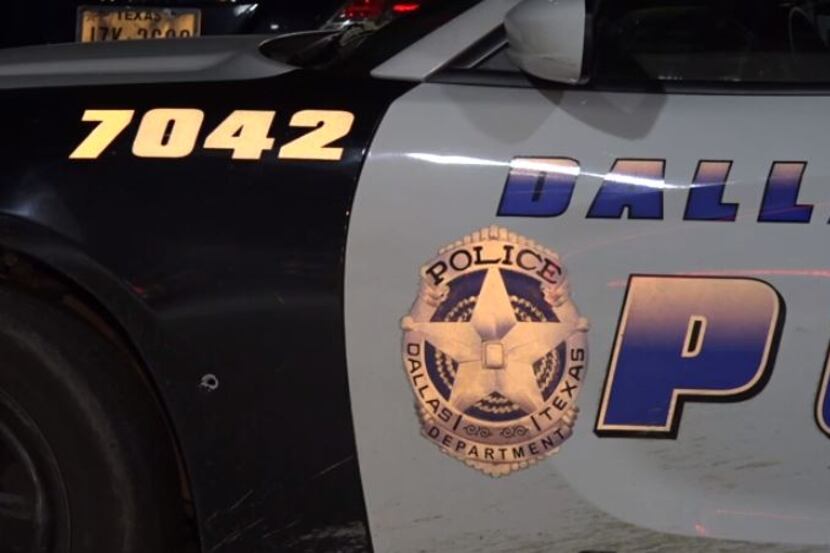 A Dallas police squad car was struck by a bullet near its driver's-side front tire Thursday...