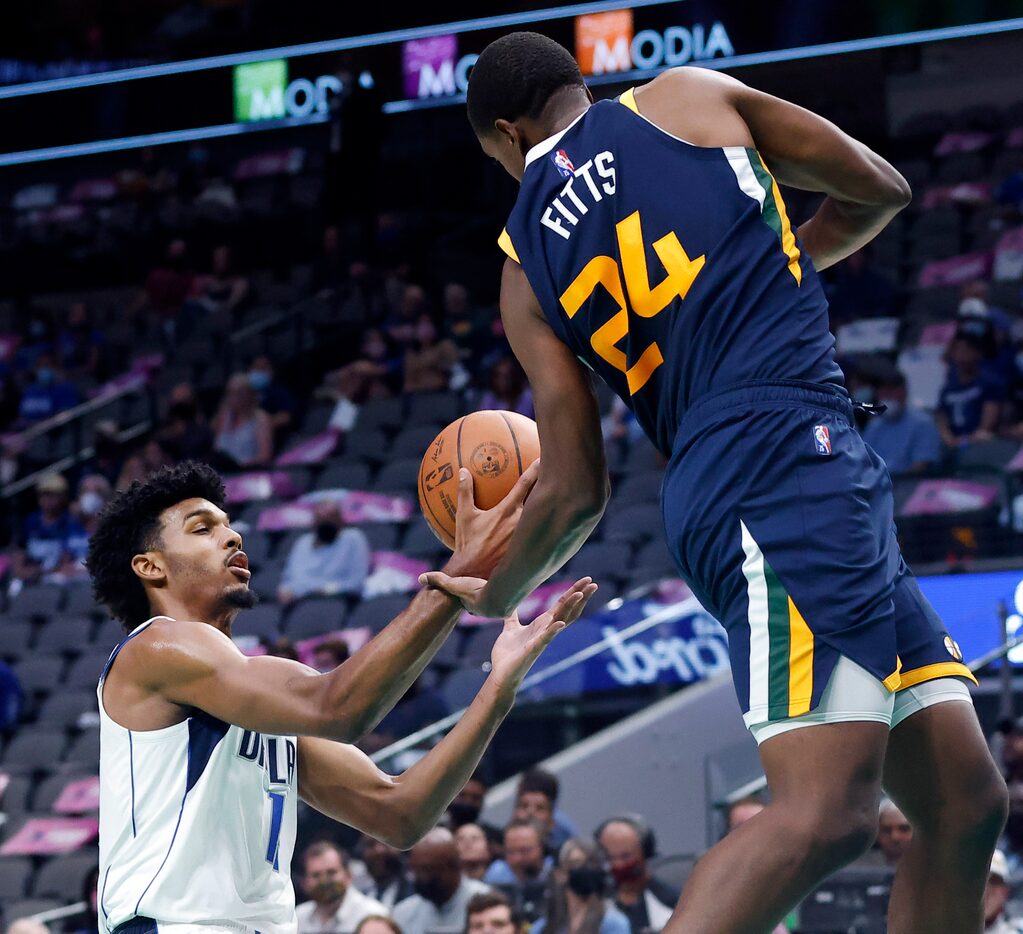 Dallas Mavericks forward Feron Hunt (14) looks to rebound the ball from Utah Jazz center...