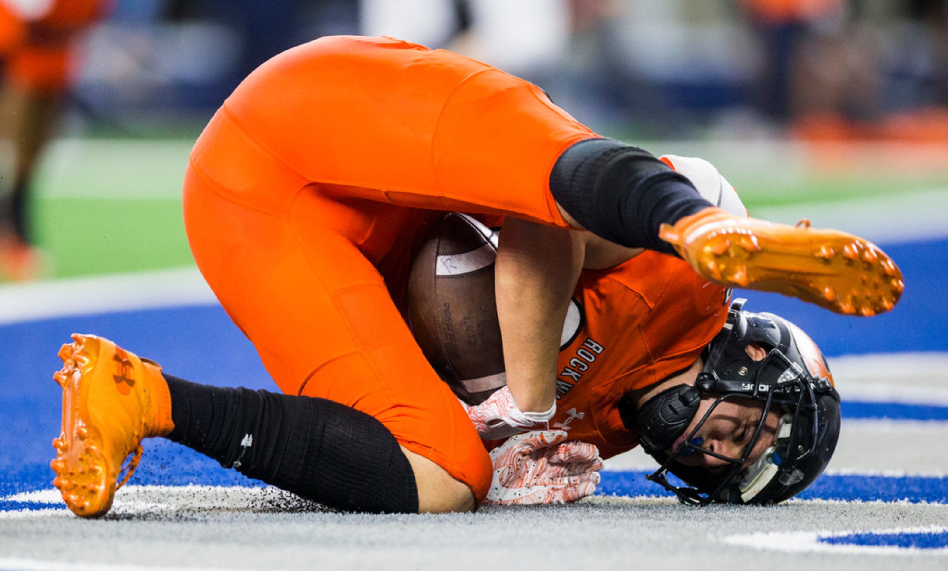 Rockwall tight end Kade Klinkovsky (83) lands in the end zone for a touchdown during the...