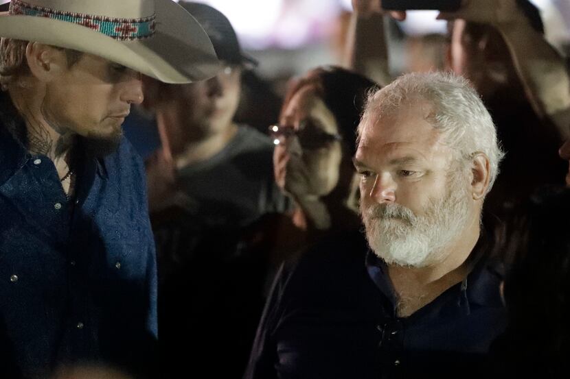 Stephen Willeford (right) and Johnnie Langendorff (left) attended a vigil on Monday for the...