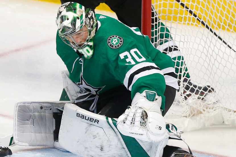 Dallas Stars goaltender Ben Bishop (30) looks to cover a puck rolling against his pad during...