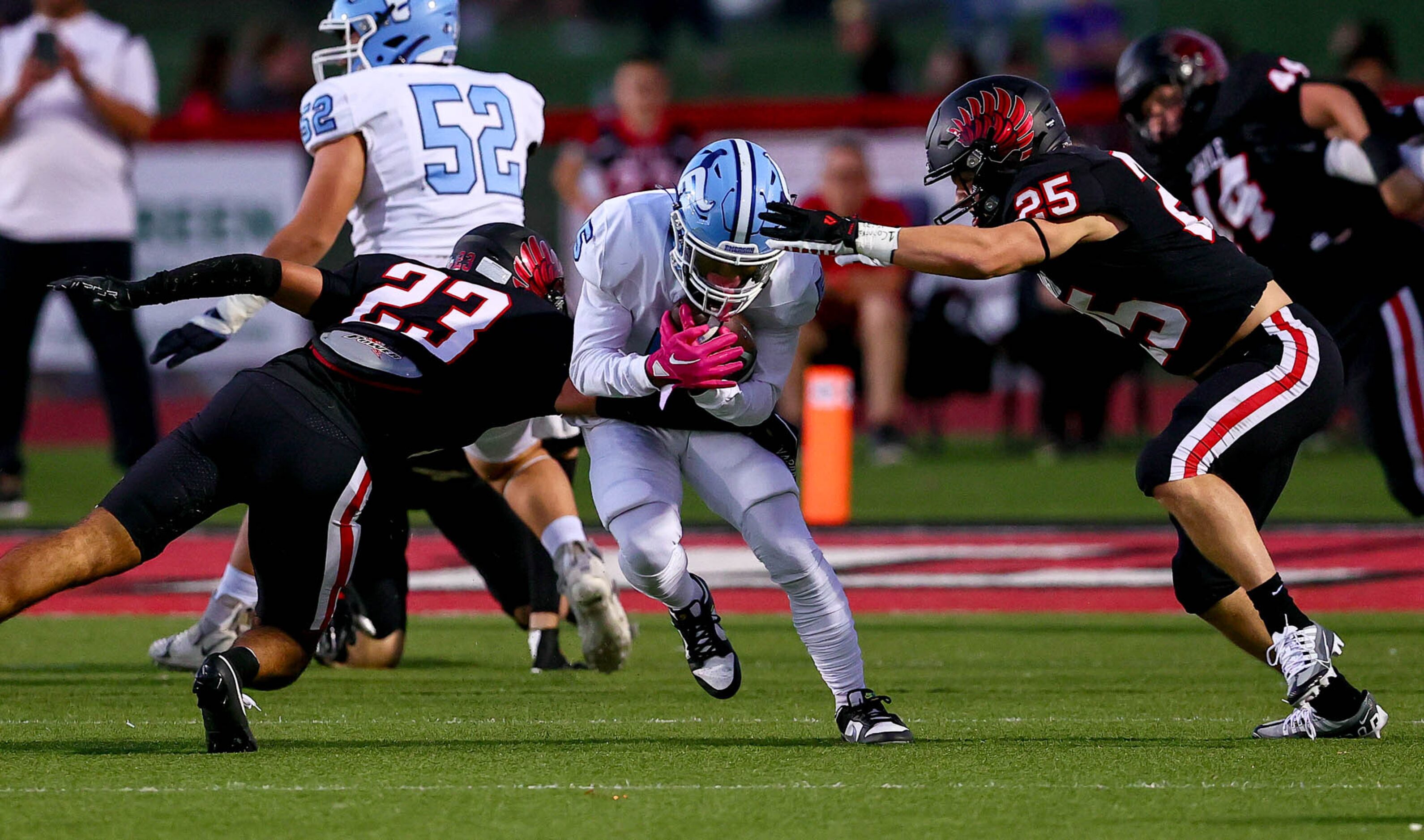 Frisco Emerson running back Ishaqq Bills (5) tries to break free against Argyle defensive...