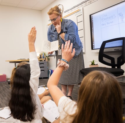 Fourth-grade teacher Carrie Jones read from the children’s book “The Borrowers” at the...