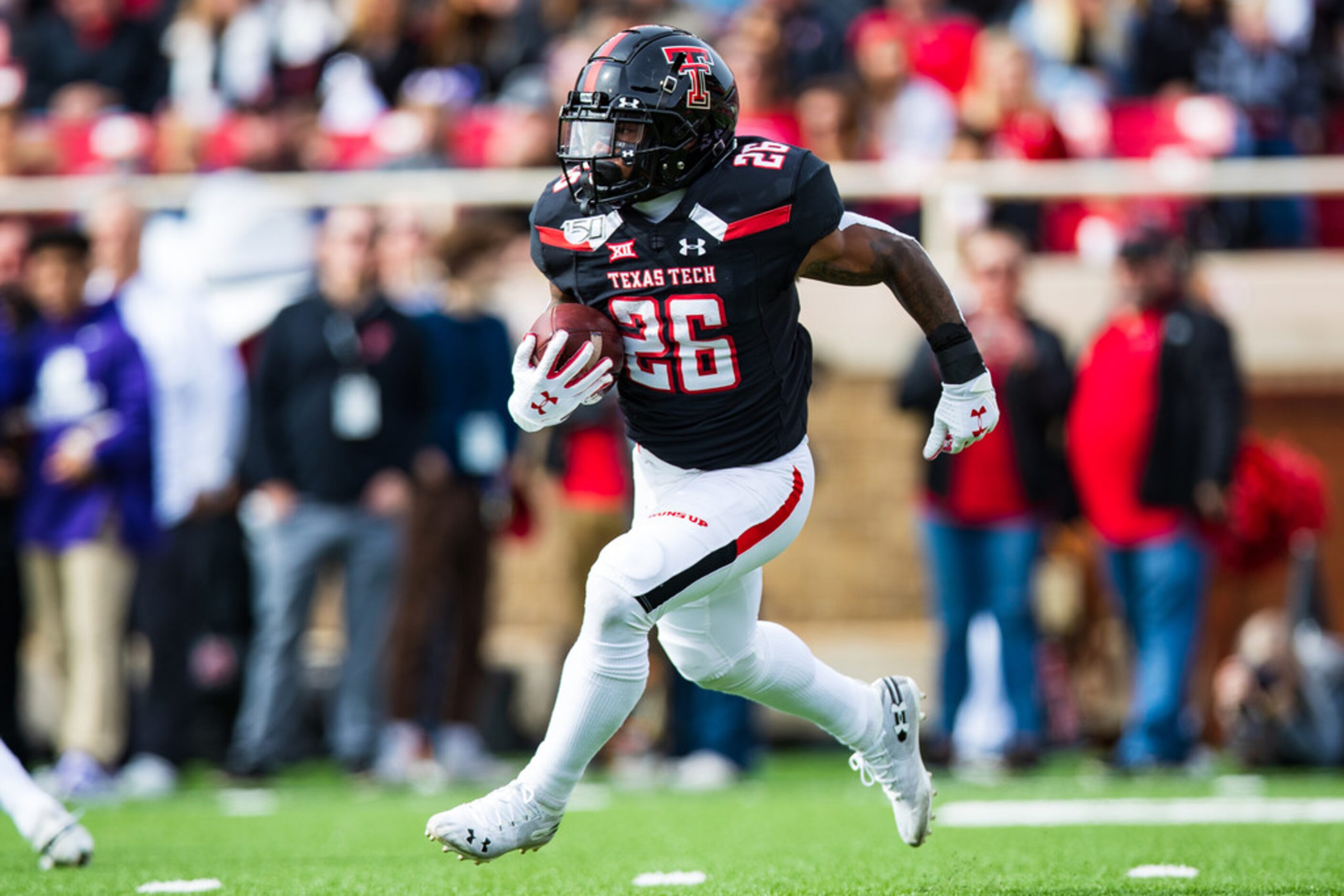 LUBBOCK, TEXAS - NOVEMBER 16: Running back Ta'Zhawn Henry #26 of the Texas Tech Red Raiders...