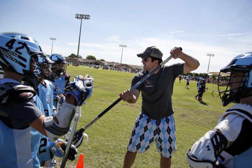 Dallas area C2C Lacrosse team coach Peter Hoffman gives directions during 2013 Texas Draw...