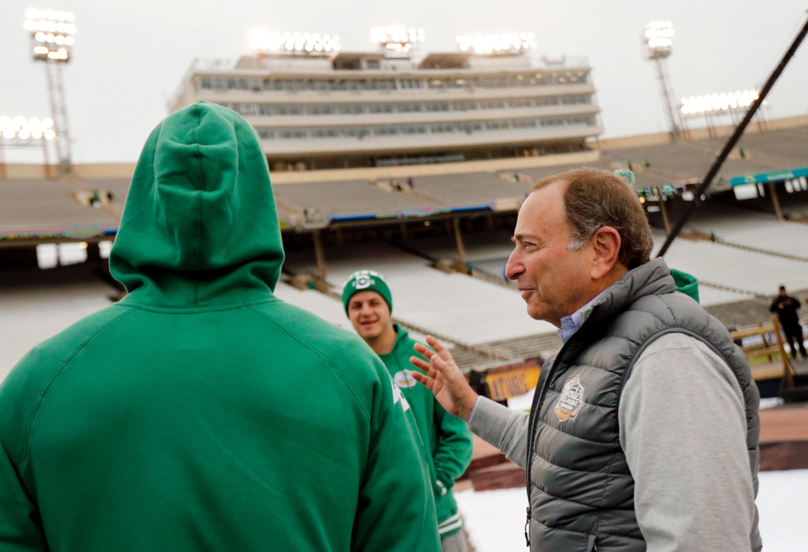 NHL Commissioner Gary Bettman (right) visits with Dallas Stars players prior to the outdoor...