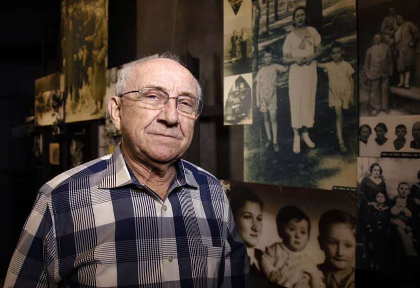 Max Glauben stands in front of some of the photographs taken of him and his mother and...