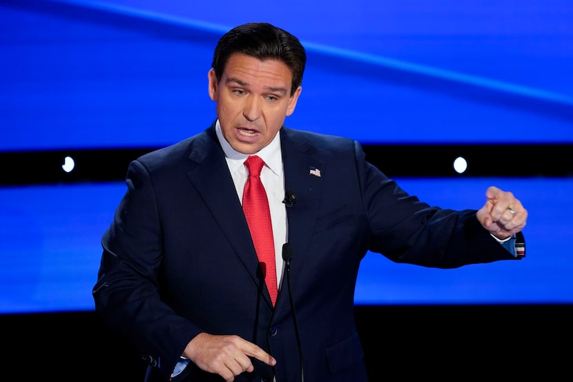 Florida Gov. Ron DeSantis gestures at the CNN Republican presidential debate with former UN...