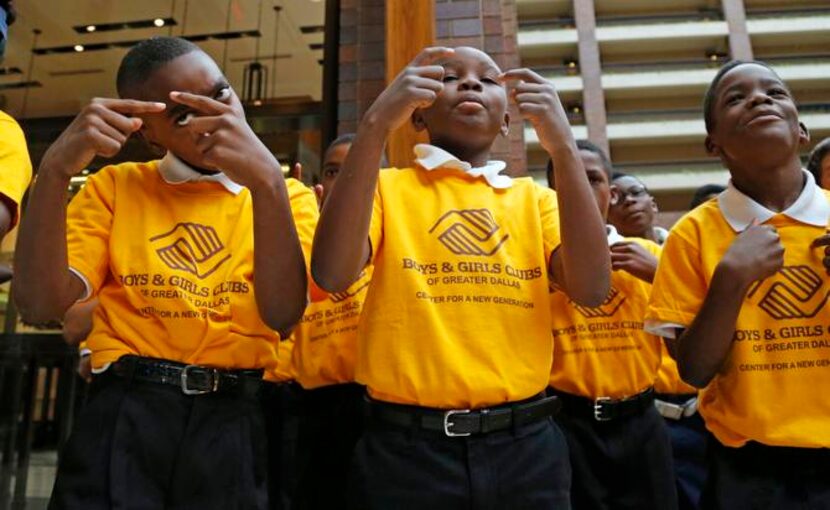 
Paul L. Dunbar Learning Center students (from left) Dontavion Alexander, 10; Deryante...