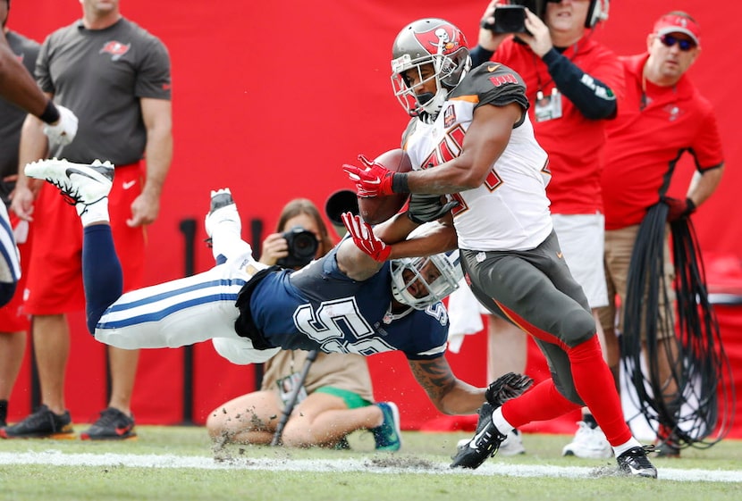 Dallas Cowboys middle linebacker Anthony Hitchens (59) breaks up a pass in the end zone...