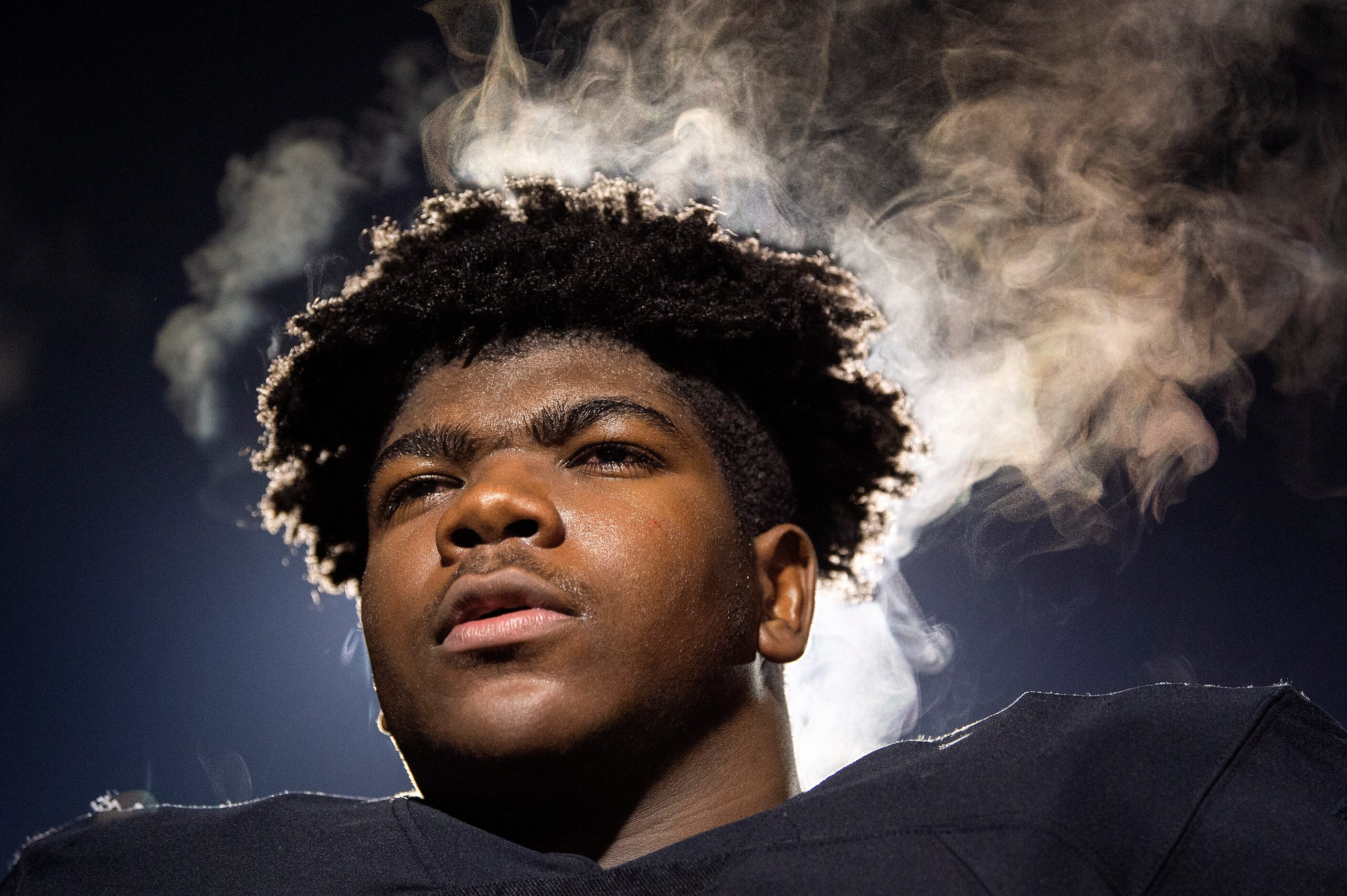 Steam rises from the head of Coppell junior defensive lineman Simi Ncube-Socks (92) as he...