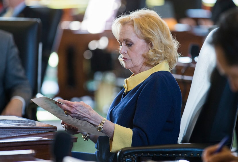 Senator Beverly Powell looked over documents at her desk on the second day of the 86th Texas...