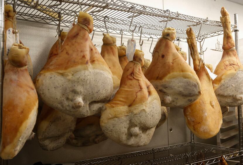 Patience, please: Prosciutto is aging in one of the Commissary's refrigerators. It takes 12...