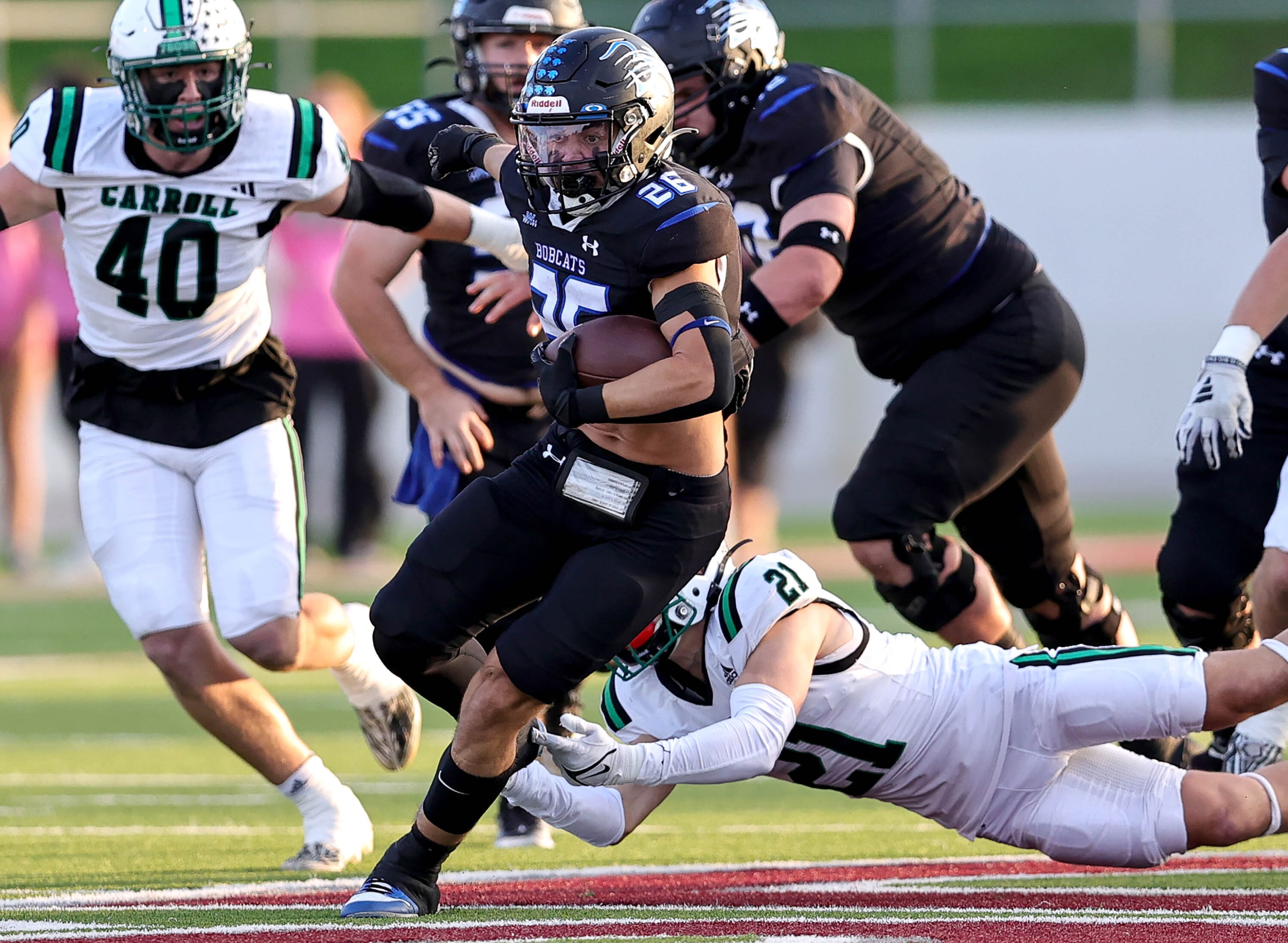 Byron Nelson running back Tucker James (26) breaks free from Southlake Carroll defensive...