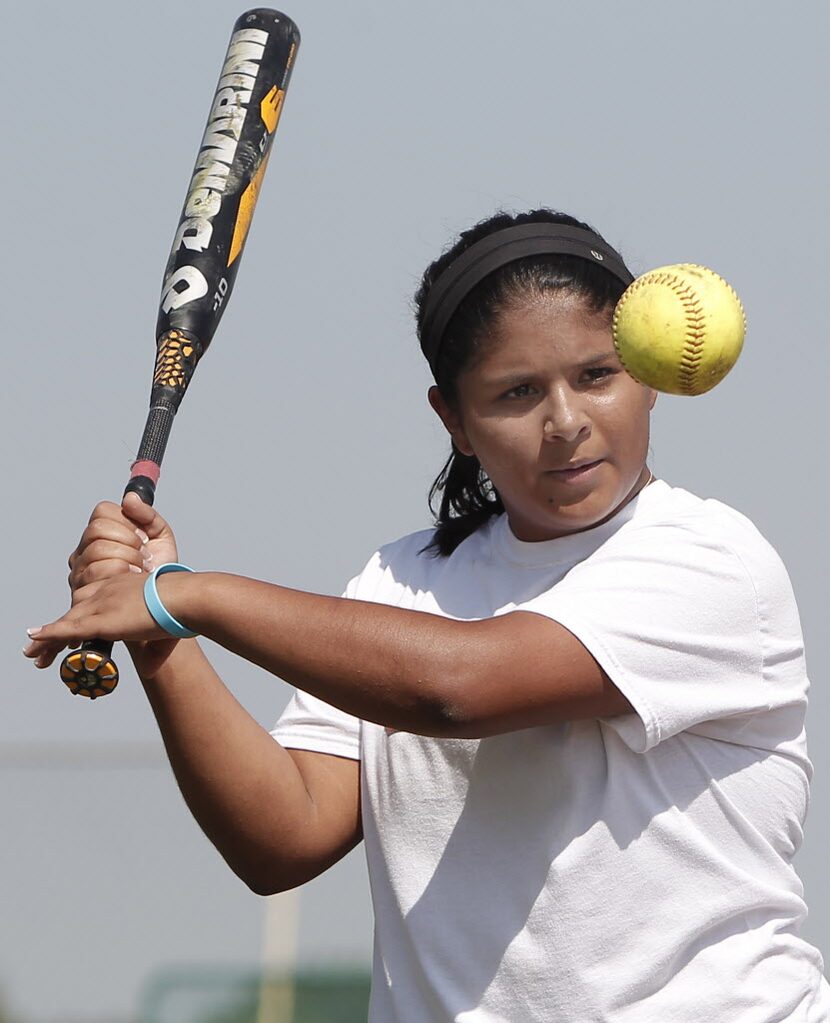 Argyle varsity shortstop Adilen Gonzalez participates in softball drills during practice at...