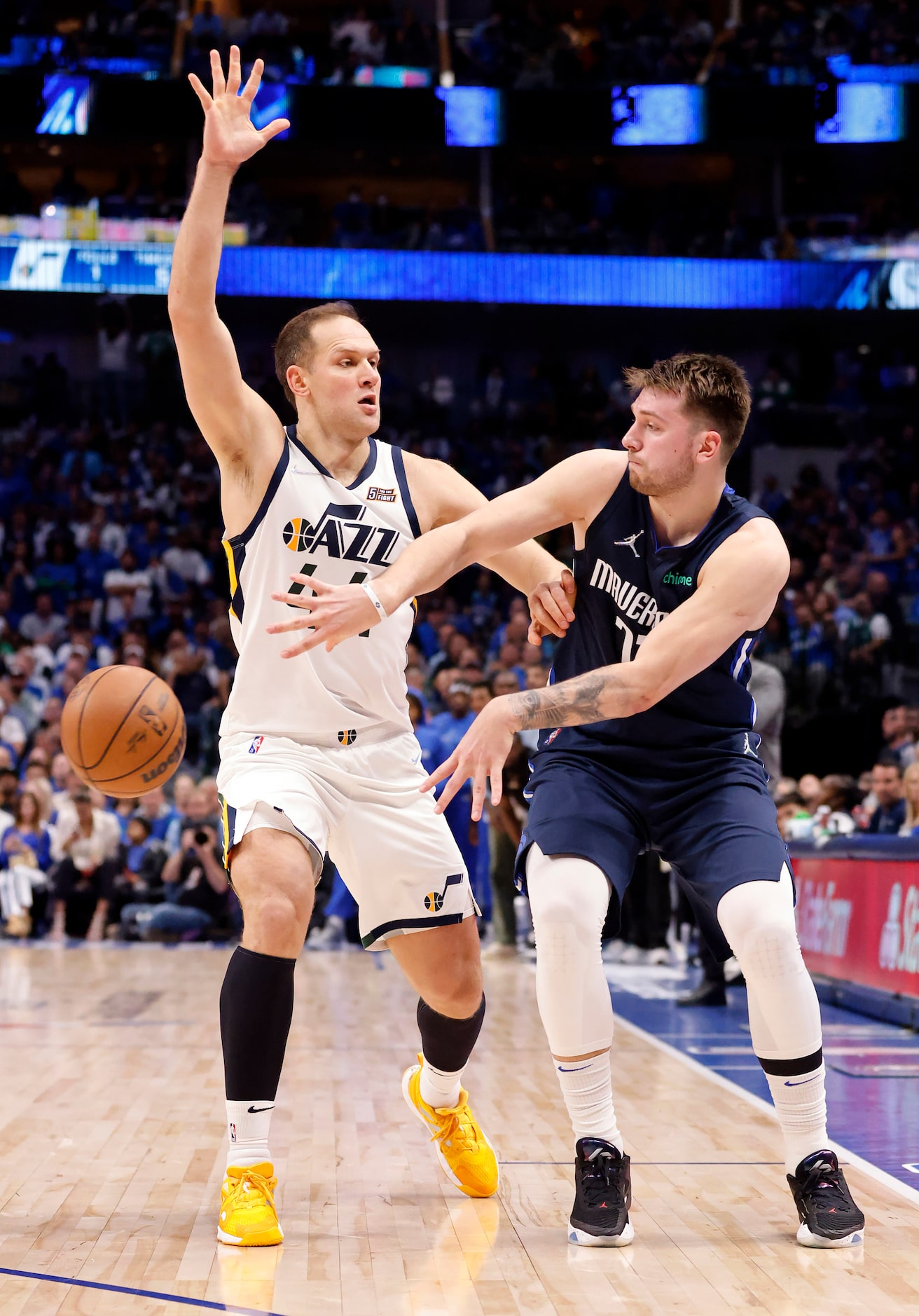 Dallas Mavericks guard Luka Doncic (77) passes the bal past Utah Jazz forward Bojan...