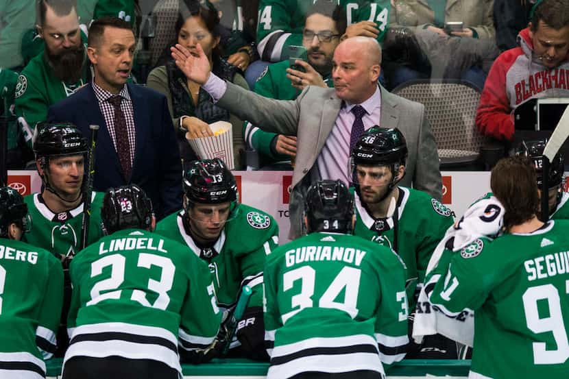 Dallas Stars head coach Jim Montgomery talks to his team during the second period of an NHL...
