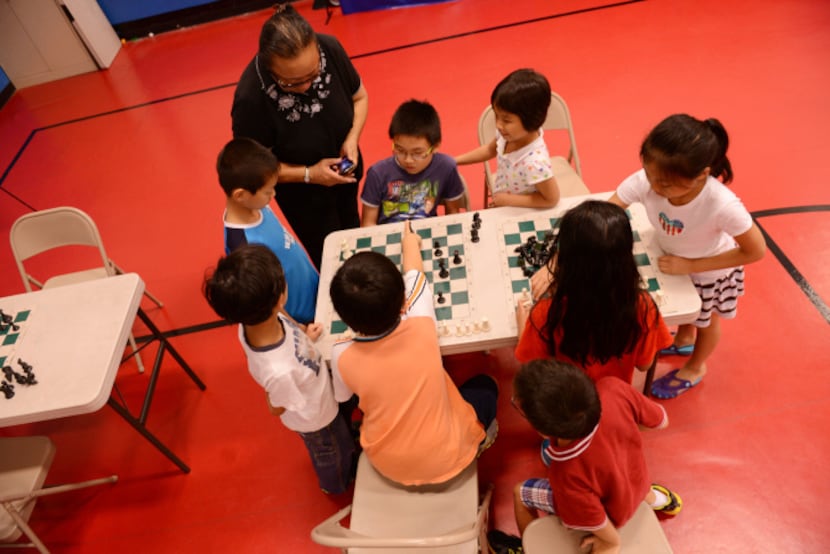 Students play chess at HuaYi Education, a Chinese school offering supplemental education and...