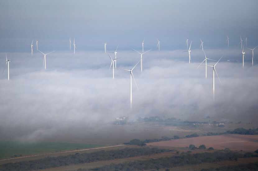 LA GRULLA, TX - DECEMBER 10:  A fog lifts as windmills turn near the U.S.-Mexico border on...