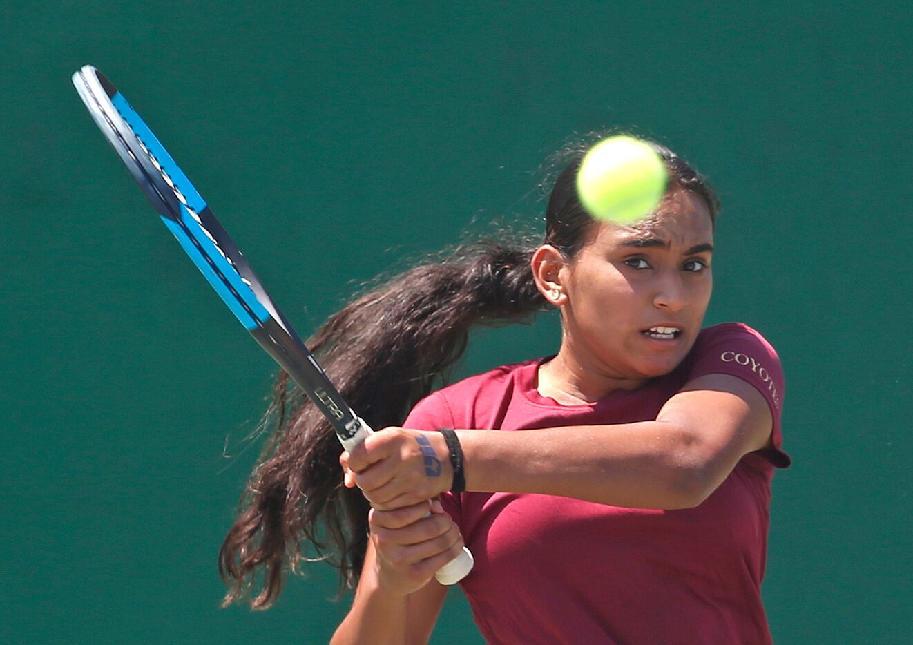 Sriya Leesha Gourammagari, of Frisco Heritage, returns a serve in a 5A girls singles match....