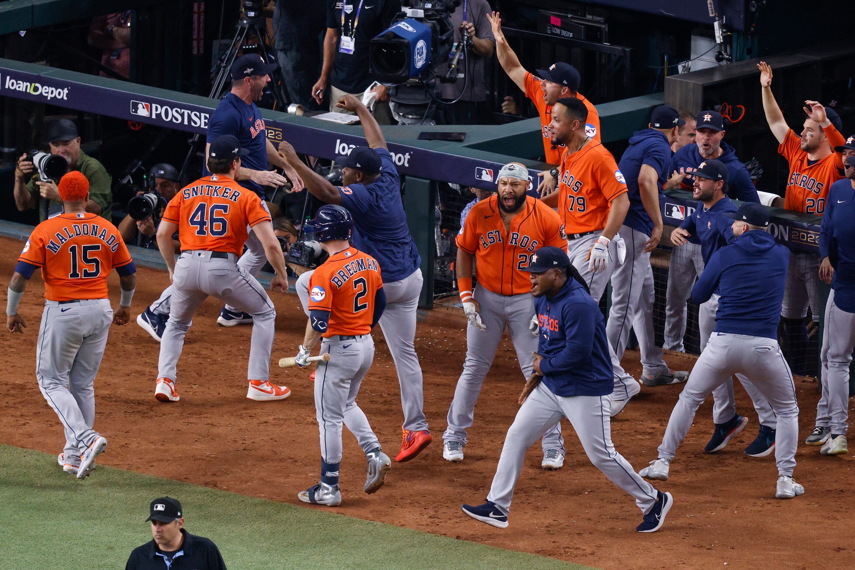 The Houston Astros celebrate a three-run go-ahead home run by second baseman Jose Altuve...